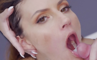 Tina Tiny on her knees all covered in jizz swallowing it
